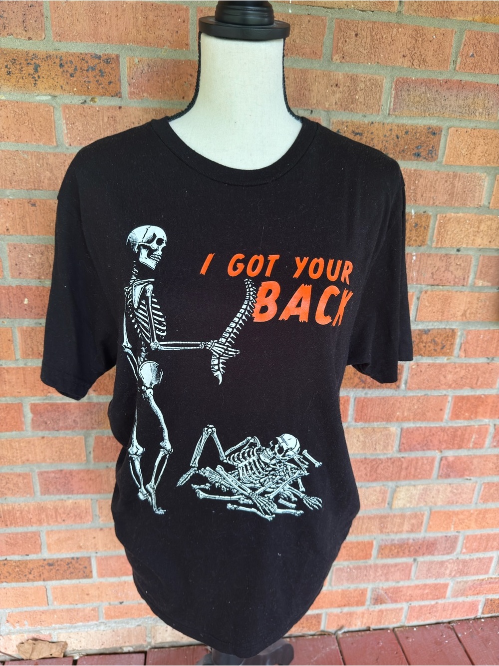 2 Black Graphic Tees - I Got Your Back Skeleton Print and Western Skeletons